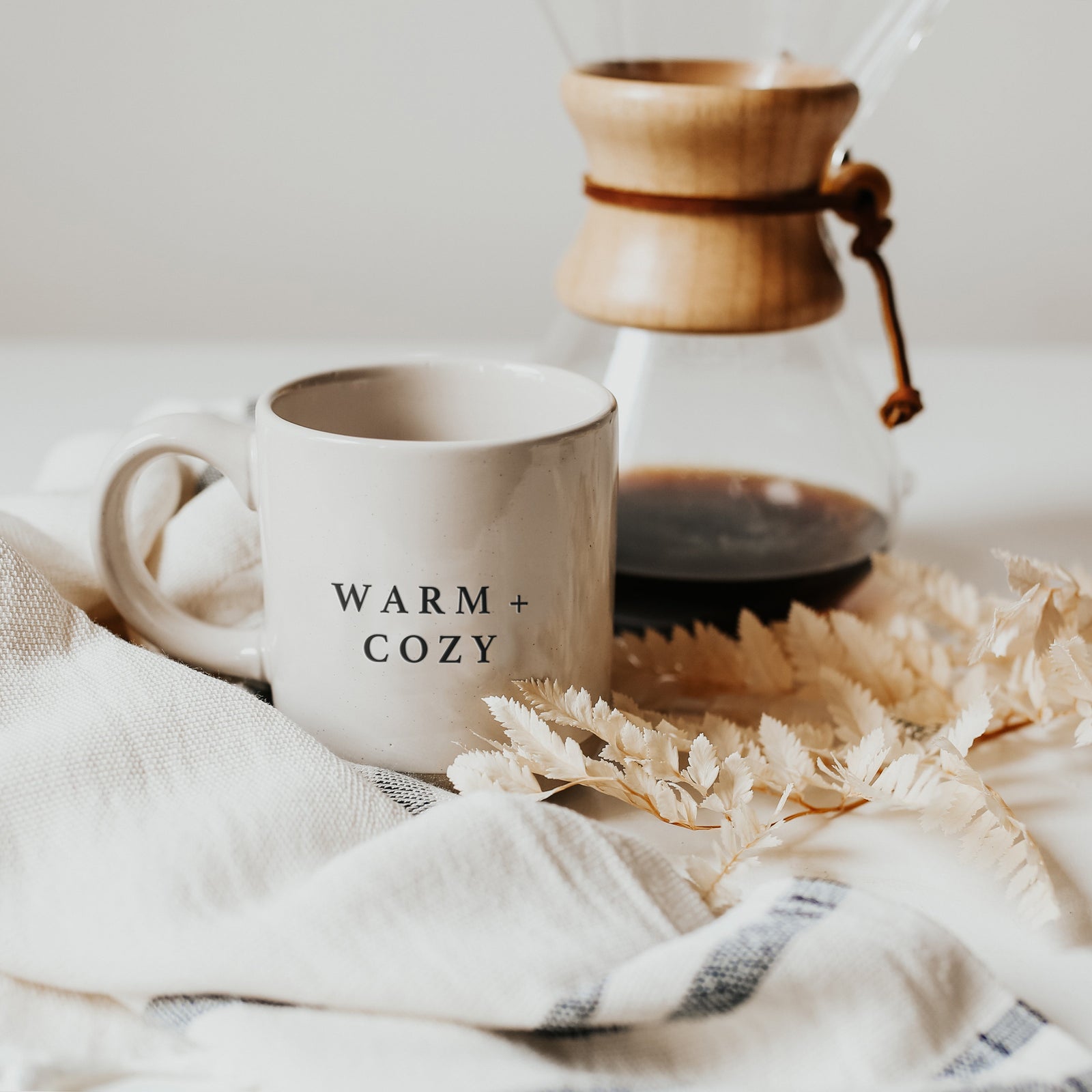 Rustic enamel coffee cup with word coffee on it and decorative