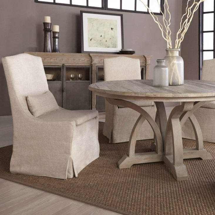 https://www.acottageinthecity.com/cdn/shop/products/Colette_Slipcover_Bisque_French_Linen_Dining_Chair_4_1200x.jpg?v=1676902490